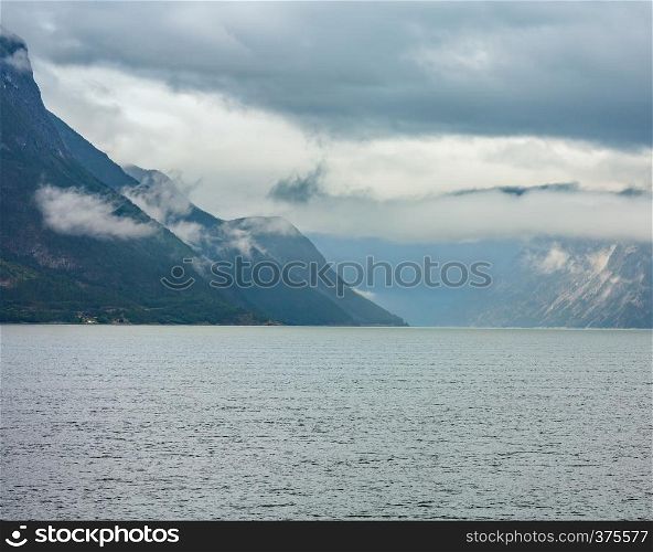 Beautiful summer cloudy evening fjord view, Norway