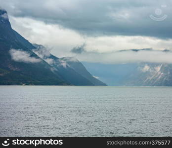 Beautiful summer cloudy evening fjord view, Norway