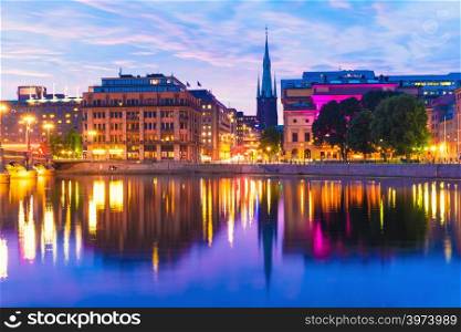 Beautiful summer evening scenery of sunset in the Old Town (Gamla Stan) architecture near the Vasa Bridge (Vasabron) in Stockholm, Sweden
