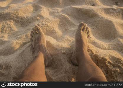 beautiful summer feet on beach view photo. beautiful summer feet on beach view