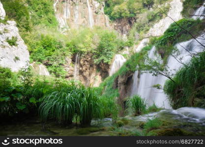 Beautiful summer forest waterfall. Plitvice National Park, Croatia.