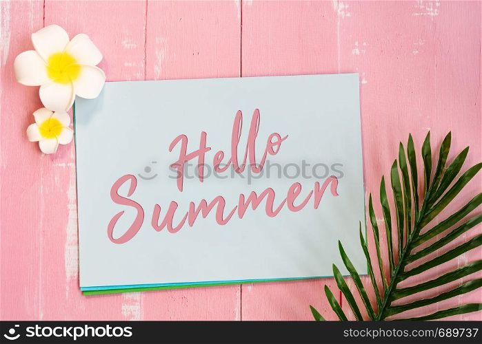 Beautiful summer holiday, Beach accessories, flower and palm leave on paper for copy space