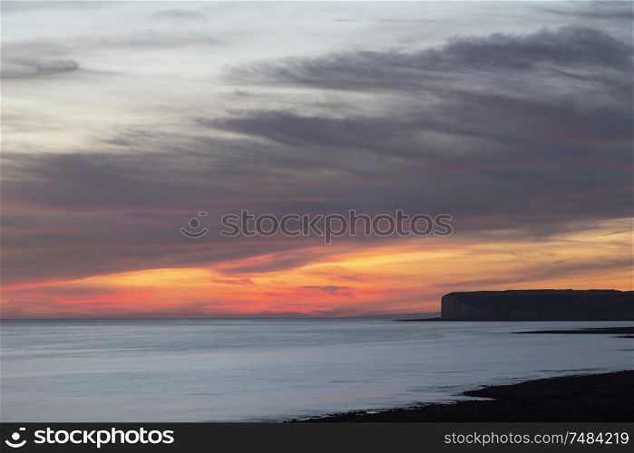 Beautiful Summer landscape sunset image of Seven Sisters chalk cliffs in England