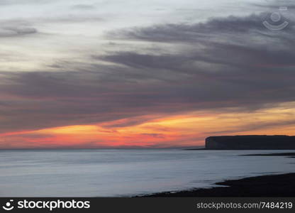 Beautiful Summer landscape sunset image of Seven Sisters chalk cliffs in England