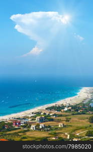 Beautiful summer Lefkada coast beach and kiteboarders (Greece, Ionian Sea, view from up). All people are not identifiable.