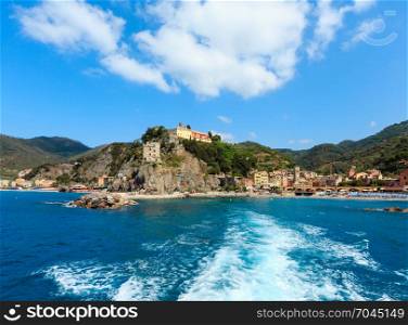 Beautiful summer Monterosso view from excursion ship. One of five famous villages of Cinque Terre National Park in Liguria, Italy. People unrecognizable.