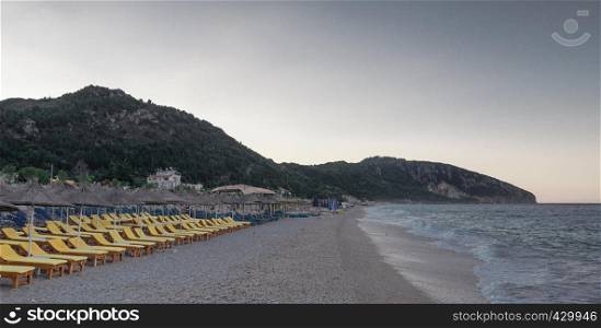 Beautiful summer morning on a sandy beach in Dhermi, Albania. Summer morning in Dhermi, Albania