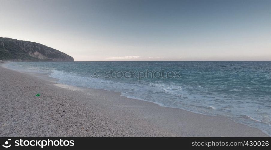Beautiful summer morning on a sandy beach in Dhermi, Albania. Summer morning in Dhermi, Albania