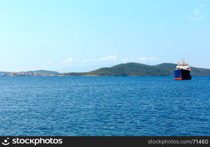 Beautiful summer morning seascape with ship, view from Athos Peninsula coast (Halkidiki, Greece).