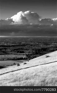 Beautiful Summer sunset landscape image of South Downs National Park in English countryside black and white image