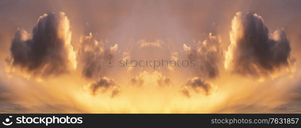 Beautiful Summer sunset sky with heart shaped cloud panorama in Facebook banner proportions and colorful vibrant clouds and sun beams across whole sky