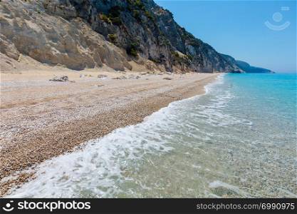 Beautiful summer white Egremni beach on Ionian Sea view (Lefkada, Greece). People unrecognizable.