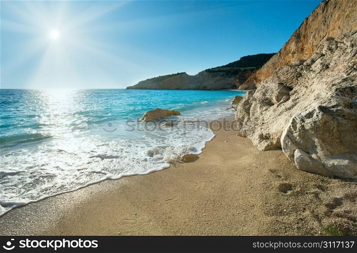 Beautiful summer white Porto Katsiki beach on Ionian Sea (Lefkada, Greece) with sun in sky