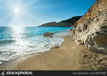 Beautiful summer white Porto Katsiki beach on Ionian Sea (Lefkada, Greece) with sun in sky