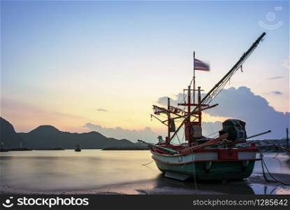 beautiful sun rising sky and local fishery boat at klong warn beach prachuap khiri khan southern of thailand