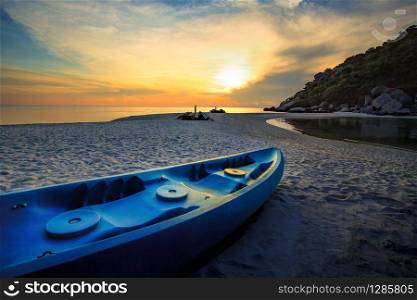 beautiful sun set sky with sea kayak on island sea beach