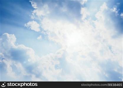 beautiful sunbeam through the cloud. dramatic sunray sky. sunlight in the sunny day. natural blue sky background. hope or dream concept.