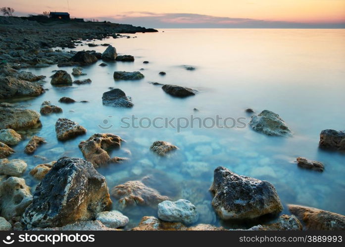 Beautiful sundown composition. Sea and rocks ad dusk.