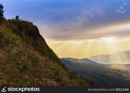 Beautiful Sunlight Rays on mountain with Landscape Photographer.