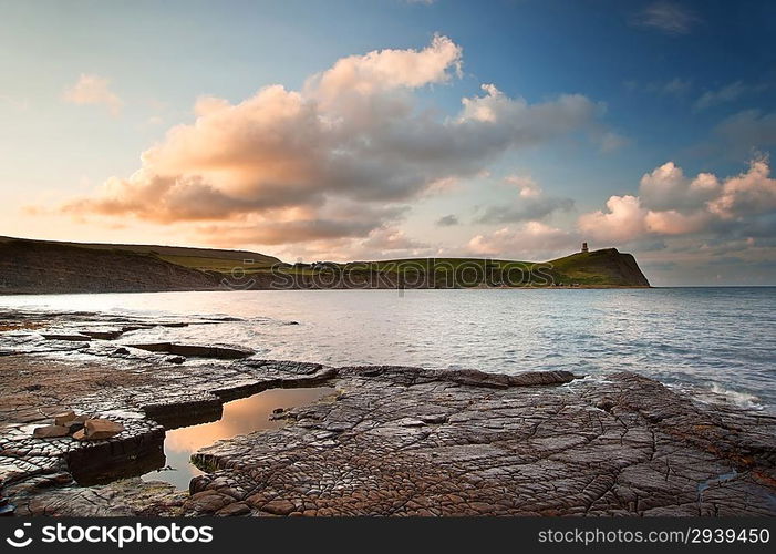 Beautiful sunrise landscape image at Kimmeridge Bay on Jurassic Coast, Dorset, England