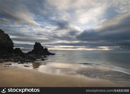 Beautiful sunrise landscape image of Barafundle Bay on Pembrokeshire Coast in Wales