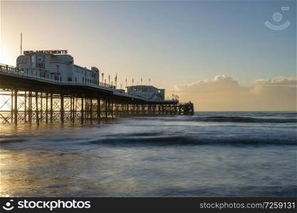 Beautiful sunrise landscape image of Worthing pier in West Sussex during Winter