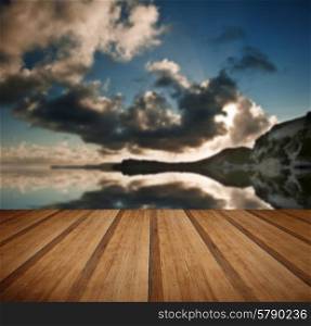 Beautiful sunrise landscape over Mupe Bay on Jurassic Coast in Dorset, England with wooden planks floor