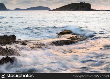 Beautiful sunrise landscape seascape over rocky coastline in Mediterranean Sea