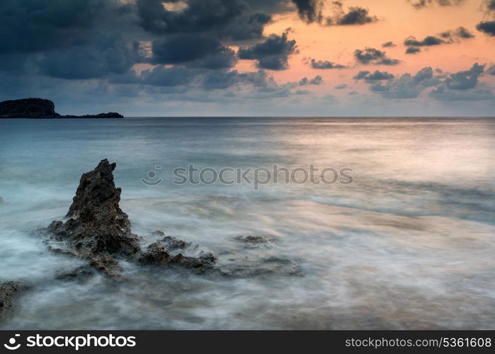 Beautiful sunrise landscape seascape over rocky coastline in Mediterranean Sea