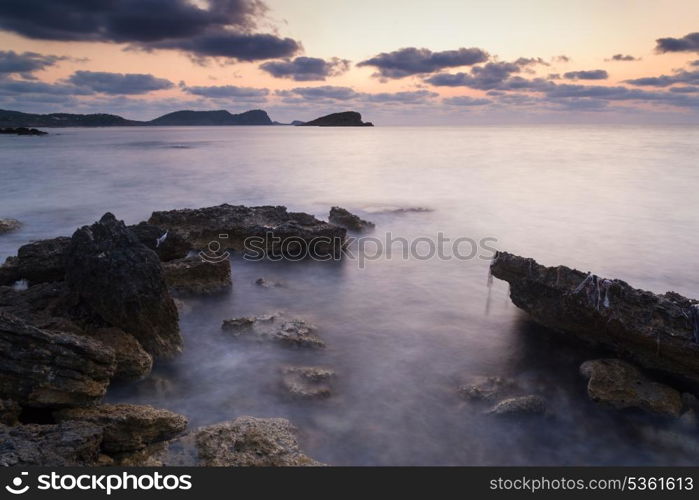 Beautiful sunrise landscape seascape over rocky coastline in Mediterranean Sea