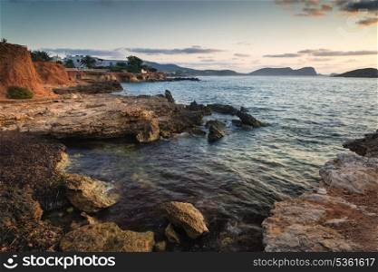 Beautiful sunrise landscape seascape over rocky coastline in Mediterranean Sea