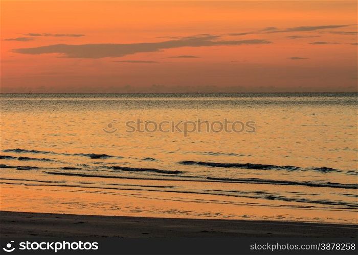 beautiful sunrise on beach and tropical sea in summer