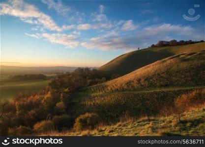 Beautiful sunrise over rolling countryside landscape in Autumn