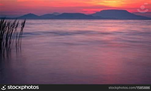 Beautiful sunrise over the lake Balaton of Hungary, long exposure