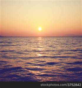 Beautiful sunrise over the sea with retro filter effect