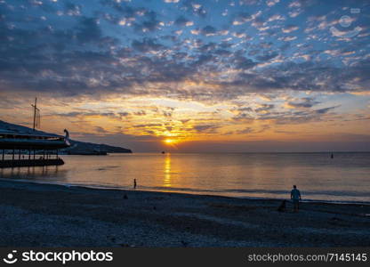 Beautiful sunrise with clouds on the southern coast of Crimea, Yalta.