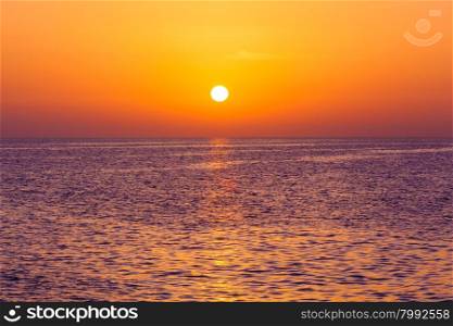 Beautiful sunset above the sea. Scenic view of beautiful sunset. Tropical sunset on the beach