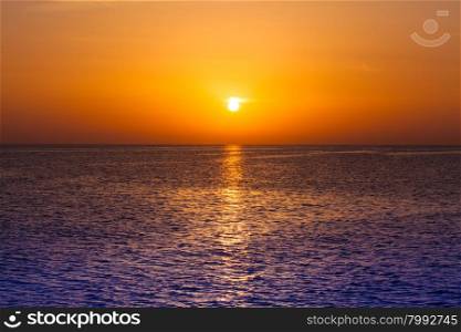 Beautiful sunset above the sea. Scenic view of beautiful sunset. Tropical sunset on the beach