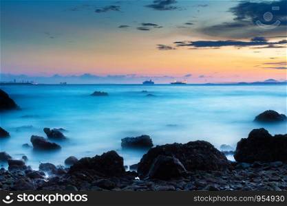 beautiful sunset at the seaside with rocks