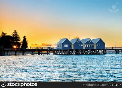 Beautiful sunset at wooden Busselton jetty in Western Australia - longest timber piled jetty in the southern hemisphere, with tourists silhouettes