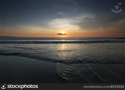 Beautiful sunset by the ocean in Bali. Beautiful sunset in Bali