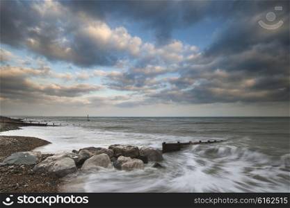 Beautiful sunset landscape image of pier at sea in Worthing England