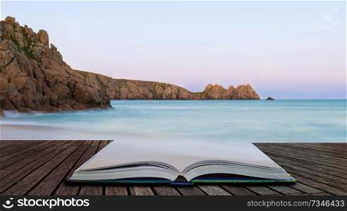 Beautiful sunset landscape image of Porthcurno beach on South Cornwall coast in England coming out of pages in magical story book