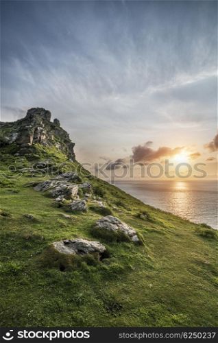 Beautiful sunset landscape image of Valley of The Rocks in Devon England