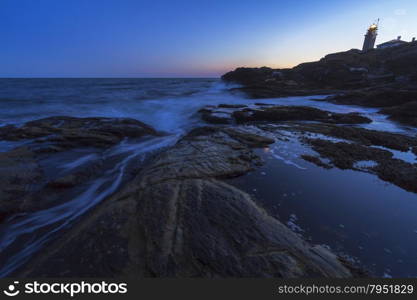 Beautiful sunset on a rocky ocean shore. Sunset on a rocky shore.