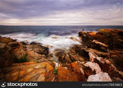 Beautiful sunset on a rocky ocean shore. Sunset on a rocky shore.