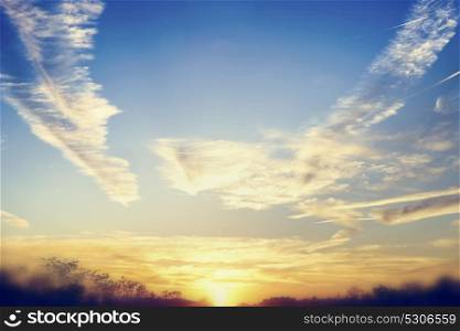 Beautiful sunset or dawn sky background with amazing clouds and Sunshine, outdoor landscape