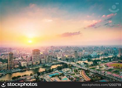 Beautiful sunset over modern Cairo on river Nile, Egypt. Cairo at sunset
