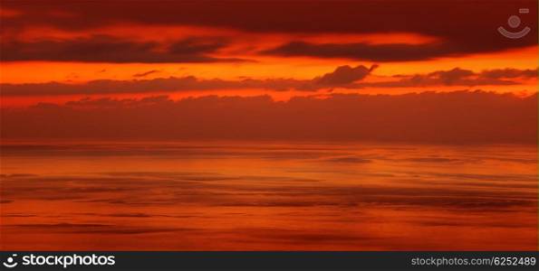 Beautiful sunset over sea, red dramatic skyscape, amazing evening panoramic scene, wonderful nature background