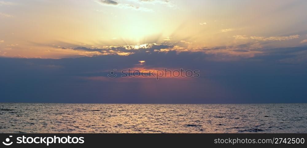 Beautiful sunset over sea surface. Four shots composite picture.